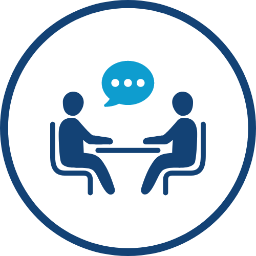 Cartoon icon of 2 figures sitting at table talking