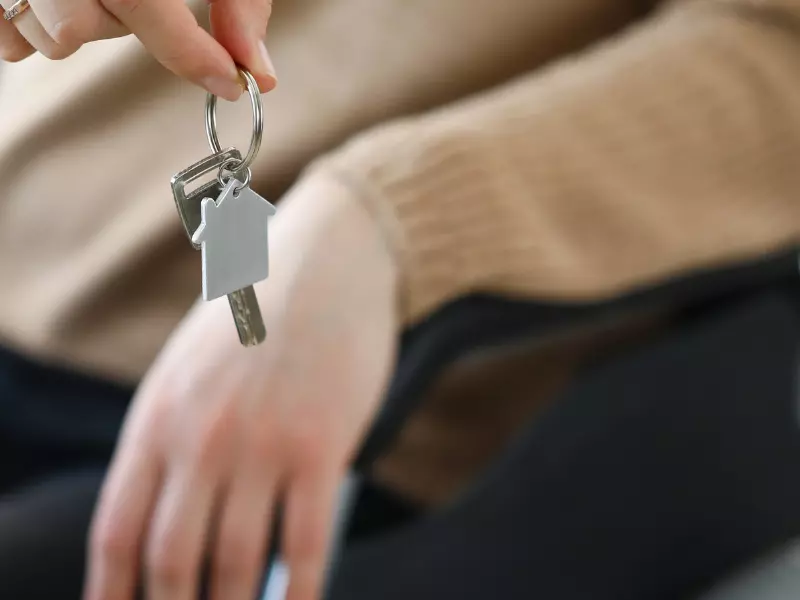 Close up of disabled woman in wheelchair holding house keys